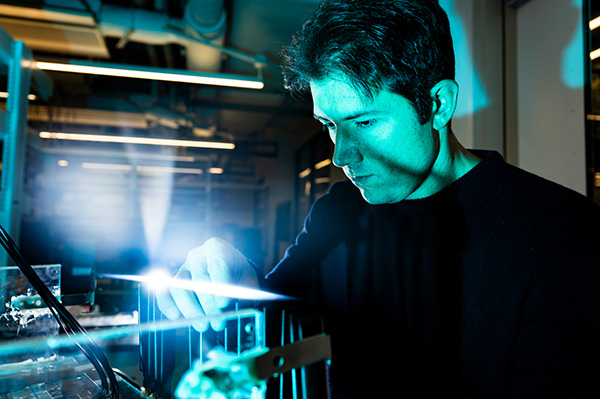 Francesco Restuccia, a professor of electrical and computer engineering, working in a lab.