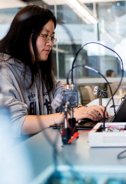 Computer Engineering student working in lab