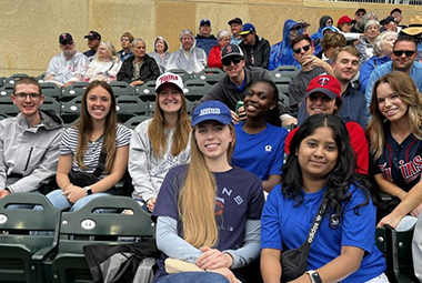 pattala and graco team at a baseball game