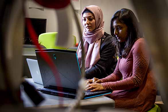 two women working at computer