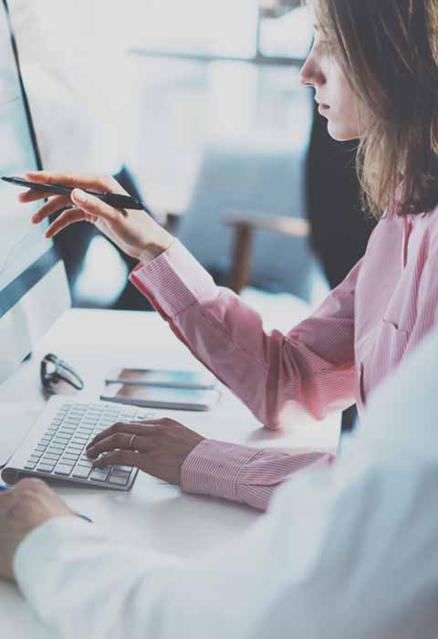student touching computer screen